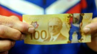 Canadas New 100 Hundred Dollar Bill Waterproof Plastic Money [upl. by Attennaj]