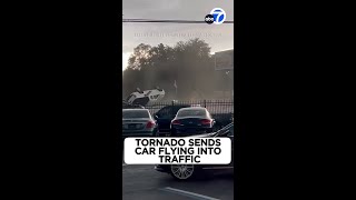 Tornado sends car flying into oncoming traffic [upl. by Wynne]