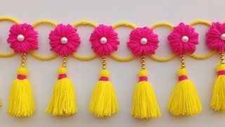 ऊन से बनाए नए डिजाइन की तोरणWoolen toran designWoolen flower door hangingWoolen craft ideaswool [upl. by Gnort]