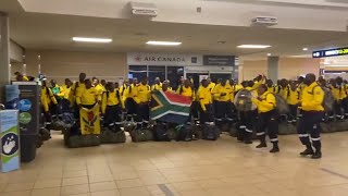 South African firefighters sing and dance after arriving at Edmontons airport [upl. by Ellicul]