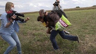 Hungarian camera woman caught on video kicking and tripping migrants [upl. by Borszcz]