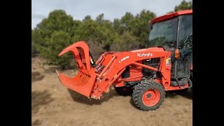 Grapple attachment on Kubota L3560 moving logs [upl. by Seif]