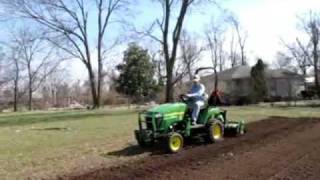 JD 2305 and tiller doing spring tillage early March 2009 [upl. by Eynobe935]