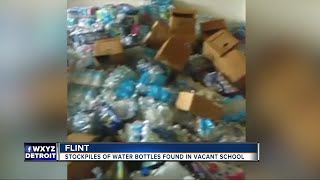 Urban explorers in Flint discover stockpiles of bottled water at abandoned school building [upl. by Yumuk]