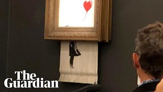 Banksy artwork selfdestructs after selling at auction for £1m [upl. by Perloff172]