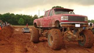 Silverado 4x4 MUD BOG STUCK pulled out by HUGE FORD DIESEL MUD TRUCK [upl. by Lesser468]