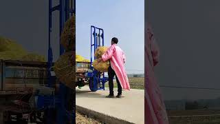 A battery powered elevator specially used for loading bales in the field [upl. by Bloomer]