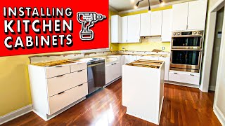 How to INSTALL KITCHEN CABINETS and remove them  DIY Kitchen Remodel Pt 1 [upl. by Enautna]