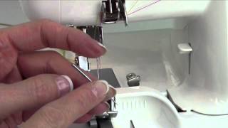 Husqvarna Viking H Class 200S Serger 12 Changing Needles [upl. by Adnawad663]