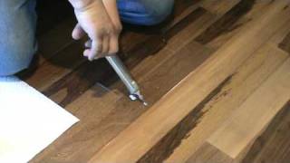 how to repair a popping floor gluedownor floating PART 1 [upl. by Lienahs]