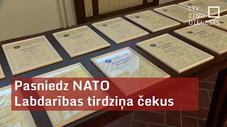 Pasniedz NATO Labdarības tirdziņa čekus [upl. by Jelks527]