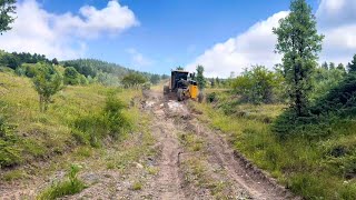 How John Deere 670 GP Grader Makes Its Way Through Green Forests johndeere motorgrader [upl. by Pollak212]