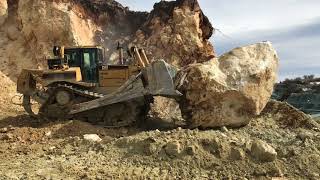 Caterpillar D8T Bulldozer Pushing Huge Stone  Labrianidis Mining Works [upl. by Lledra]