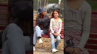 Kind woman helps little girl tie her hair shorts [upl. by Alderson543]