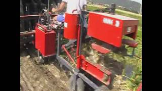 ERME 1row garlic harvesterbinderwmv [upl. by Anirhtak19]