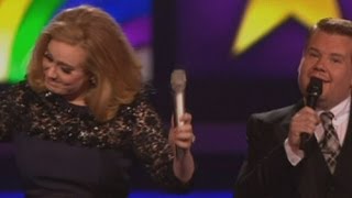 Adele gives the middle finger after being cut off by James Corden at The Brits [upl. by Enovahs]