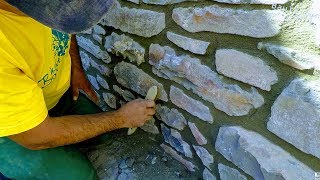 HOW TO BUILD NATURAL STONE WALL RETAINING ROCK BOULDERS DETAIL MASONRY ADVICE TUTORIAL CONSTRUCTION [upl. by Myrah]