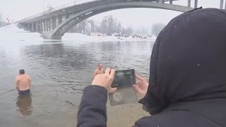 Brave swimmers brace icy waters to mark the Epiphany in Russia and the Ukraine [upl. by Wiltsey]