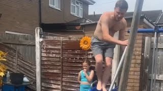 Uncles wipeout Soapy slide turns uncle into a human sled  WooGlobe [upl. by Hesper]