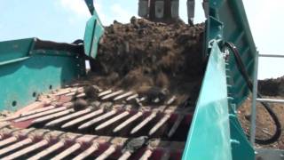 Powerscreen Warrior 1800 mining a landfill [upl. by Anaz]