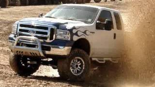 LIFTED FORD F350 SUPER DUTY 4X4 BLASTIN THROUGH MUD HOLE [upl. by Alexandria827]