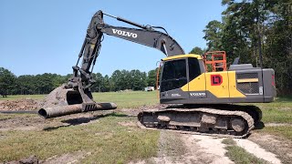 Piping The Pond Overflow Drain And Spreading Topsoil [upl. by Idak]