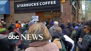 Handcuffing of 2 black men in Starbucks in Philadelphia sparks controversy [upl. by Kcirdneked]