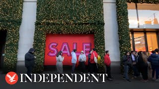 Shoppers queue outside Selfridges on Oxford Street for Boxing Day sales [upl. by Kcirded152]