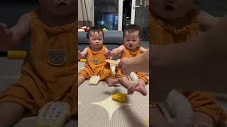 Cute Identical Twins Eating Rice Cake identicaltwins babysnacks babyfood [upl. by Edd]