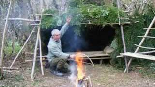 bushcraft survival long term wilderness shelter 7 of 7 heating the shelterwmv [upl. by Norford]