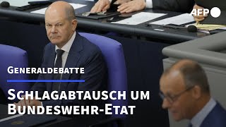 Merz und Scholz liefern sich Schlagabtausch um BundeswehrEtat  AFP [upl. by Anrev]