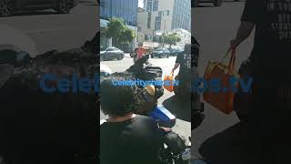 Keanu Reeves rides motorcycle past fans while leaving the roxy [upl. by Ereynihc]