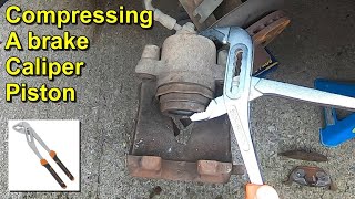 Compressing a Brake Caliper Piston Without any Special Tools [upl. by Ardnas954]