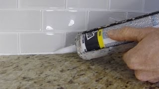 How To Install Caulk On A Kitchen Tile Backsplash [upl. by Sul530]