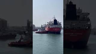 Tug boat pulling ship at port l shortfeed tugboats ships shipvideo [upl. by Pleione84]