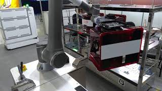 Gyro Systems Inc Autonomous Mobile Robot AMR with robot arm placing FOUP [upl. by Nylorak98]