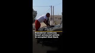 Palestinian confronts Israeli armoured vehicle in occupied West Bank  AJ shorts [upl. by Ailimac]