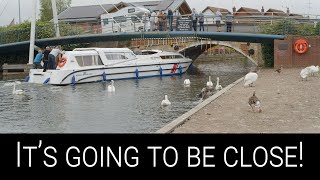 Bridge pilot takes boat expertly under low Wroxham Bridge Norfolk Broads with nothing to spare [upl. by Dhiren]