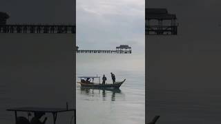 Fishing boat moving across beautiful Teluk Dalam BeachPangkor Island 美 pulaupangkor fishing wow [upl. by Ahsirahc495]