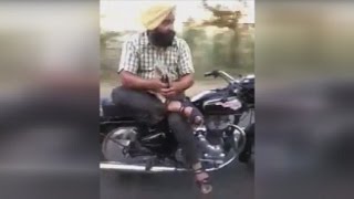 Indian Man Casually Rides Side Saddle on a Motorcycle [upl. by Pepper83]