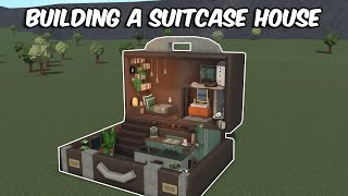 BUILDING A SUITCASE HOUSE IN BLOXBURG [upl. by Ellennoj]