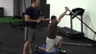 HighPerformanceHandbookcom HalfKneeling 1arm Landmine Press [upl. by Adnocahs]