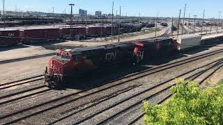 CN Train Departs MacMillan Yard Vaughan Toronto Ontario CN 2864 3877 Passing CN GP9RM 7276 Slug 276 [upl. by Placidia]