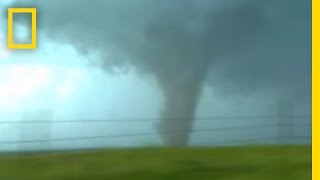 Tornadoes Lightning in Rare Video  National Geographic [upl. by Pattin835]