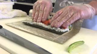 A sushi chefs demonstration of the technique for making a California roll [upl. by Ahsuatan]