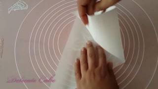 طريقه صنع كيس حلوانى من ورق الزبدة how to make a parchment paper piping bag [upl. by Dustin]