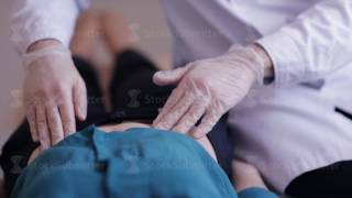 Closeup of doctors hands in gloves do palpation patient [upl. by Aivat958]