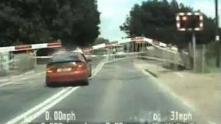 Amazing highspeed police chase as car smashes through level crossing barrier [upl. by Ojok615]