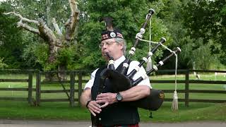 Piper at Cawdor Castle playing Scotland The Brave [upl. by Oninotna234]