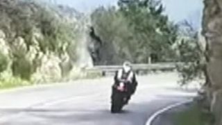 Motorcycle flips over cliff in scary crash caught on tape [upl. by Oiratnom]